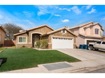 Charming single-story home with a two-car garage and well-maintained lawn at 2903 Galena Peak Ln, Las Vegas, NV 89156