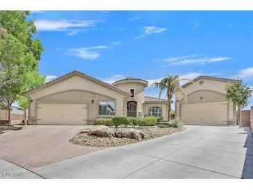 Charming single-story home with well-manicured landscaping, three car garage, and inviting curb appeal at 6150 Bunker Commons Ct, Las Vegas, NV 89108