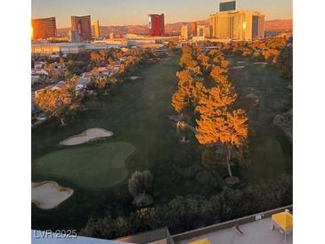 Expansive golf course view with sand traps and city skyline in the background at sunrise at 3111 Bel Air Dr # 15G, Las Vegas, NV 89109