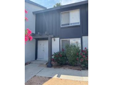 Charming two-story home with a covered entrance and tidy landscaping at 4016 Edgeford Pl, Las Vegas, NV 89102