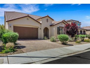 Charming home featuring a tile roof, desert landscaping, and brick driveway at 5713 Silver Cascade Ave, Las Vegas, NV 89131