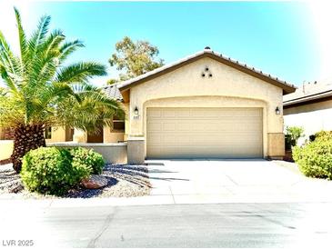 Charming single-story home with a well-manicured lawn and a spacious two-car garage at 6001 Falconer Ave, Las Vegas, NV 89122