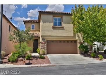 Charming two-story stucco home with a two-car garage and desert landscaping at 7733 Donner Peak St, Las Vegas, NV 89166