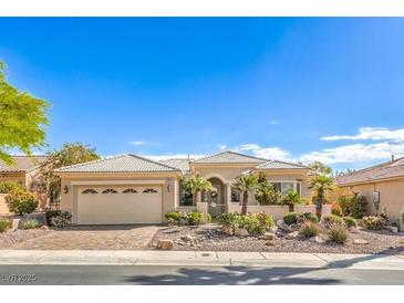 Beautiful single-story home with a two-car garage and desert landscaping in a gated community at 10314 Premia Pl, Las Vegas, NV 89135