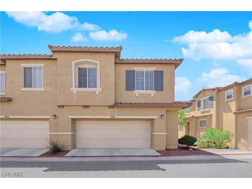 Inviting multi-story townhome featuring a two-car garage and neutral color palette at 1525 Spiced Wine Ave # 14105, Henderson, NV 89074