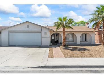 Charming single-story home featuring a two-car garage and well-maintained front yard with mature trees at 3661 Margarita Way, Las Vegas, NV 89103