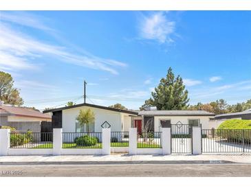 Charming single-story home with well-maintained landscaping and secure gated entrance at 3805 San Angelo Ave, Las Vegas, NV 89102