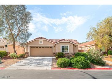Charming single-story home with a well-manicured lawn and inviting curb appeal at 4329 Skimmers Ct, North Las Vegas, NV 89084