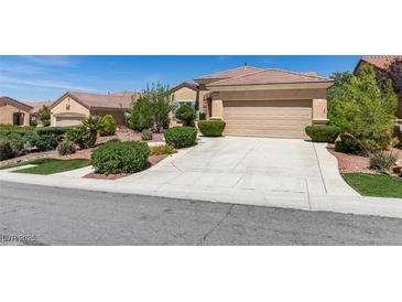 Charming single-story home featuring a well-maintained front yard and a two-car garage at , Henderson, NV 89044