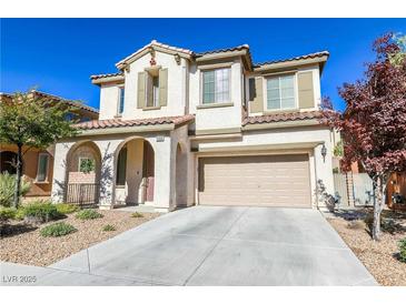 Charming two-story home with a terracotta roof, two-car garage, and covered front porch at 11900 Calle De Sol Dr, Las Vegas, NV 89138