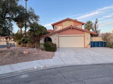 Charming two-story home featuring a wide driveway, desert landscaping, and a spacious two-car garage at 4066 Aduana Ct, Las Vegas, NV 89103