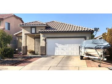 Charming single-story home with a two-car garage and well-maintained landscaping in a residential neighborhood at 6030 Halehaven Dr, Las Vegas, NV 89110