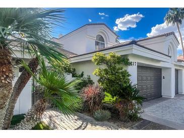 Elegant two-story home with desert landscaping and a private gated entrance, plus a two car garage at 217 Windsong Dr, Henderson, NV 89074