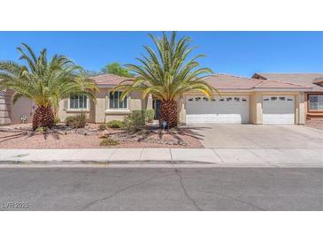 Charming single-story home featuring desert landscaping and a three-car garage at 2268 Alanhurst Dr, Henderson, NV 89052
