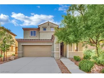 Inviting two-story home features a two-car garage, landscaped yard, and charming front porch at 2749 Invermark St, Henderson, NV 89044