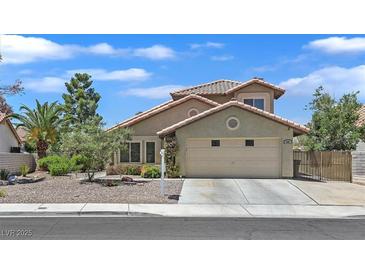 Charming single-Gathering home with a two-car garage, tile roof, and low-maintenance desert landscaping at 349 Clayton St, Henderson, NV 89074