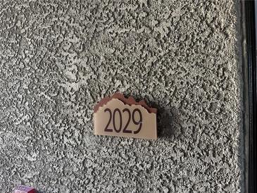 Unit address 2029 on stucco exterior at 8250 N Grand Canyon Dr # 2029, Las Vegas, NV 89166