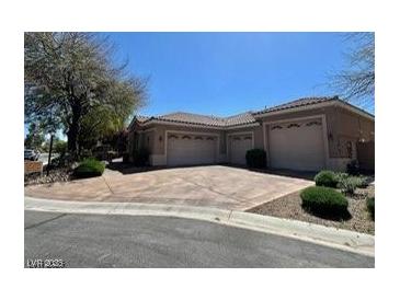 Charming one-story home with a three-car garage and a well-maintained front yard at 8777 Beckett Ridge Ave, Las Vegas, NV 89149