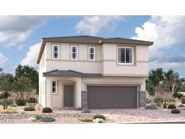 Charming two-story home featuring a two-car garage and a beautifully landscaped front yard at 9879 Angel Valley Dr, Las Vegas, NV 89178