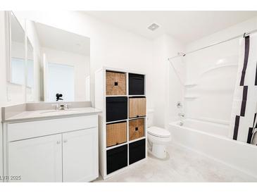 Bright bathroom featuring modern fixtures, storage, and a shower-tub combination at 3240 Avernus Ave, Henderson, NV 89044