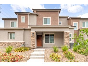 Charming two-story home with desert landscaping and stone accents on the front exterior at 10777 Briset Ct, Las Vegas, NV 89166