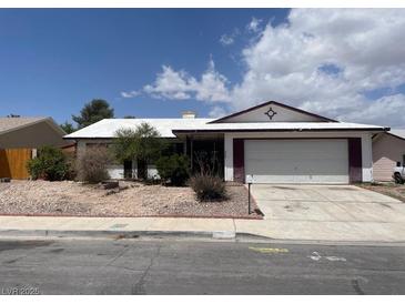 Single-story home featuring an attached garage and desert landscaping at 204 Bradshaw Way, Las Vegas, NV 89145