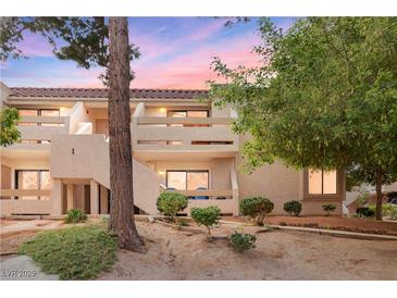 Inviting two-story condo featuring private balconies and mature landscaping at sunset at 3740 Desert Marina Dr # 2, Laughlin, NV 89029