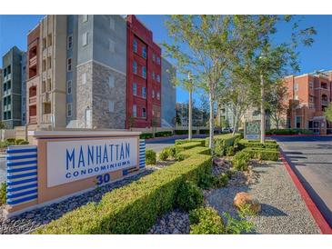 Manhattan Condominiums features colorful buildings, manicured landscaping, and clear signage at 50 E Serene Ave # 420, Las Vegas, NV 89123