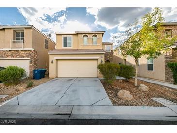 Two-story home boasts a front-facing two-car garage and stone veneer accents at 9019 Winchester Ridge St, Las Vegas, NV 89139