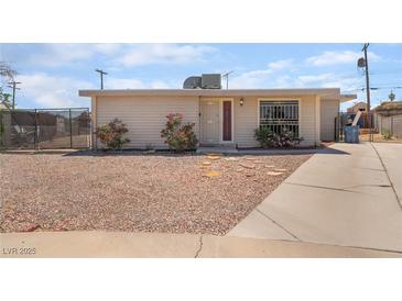 Charming single-story home featuring a low-maintenance gravel yard and a private, fenced front area at 4691 Sun Valley Cir, Las Vegas, NV 89122