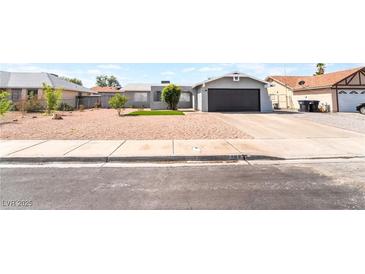 Charming single-story home with a well-maintained gravel yard and a convenient attached garage at 508 Van Dornum Ave, Henderson, NV 89011