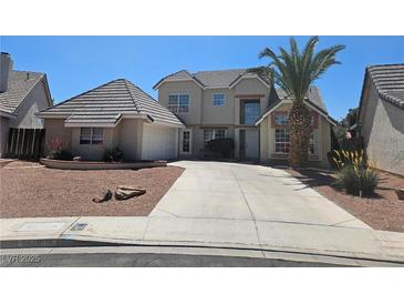 Charming two-story home with a well-manicured lawn and a spacious driveway at 6529 Bradford Ln, Las Vegas, NV 89108