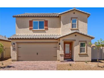 Charming two-story home featuring a brick driveway, neutral colors, and a convenient two-car garage at 6772 Violet Cascade Ave, Las Vegas, NV 89156