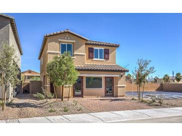 Two-story home featuring a brick-paved driveway and neutral-colored siding and shutters at 794 Calm Crystal Ct # Lot 139, North Las Vegas, NV 89081