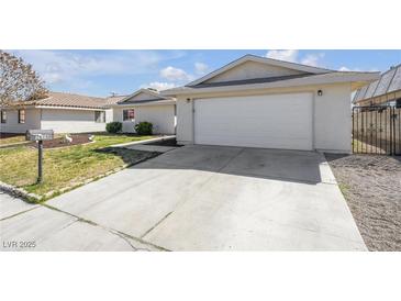 Charming single-story home featuring a two-car garage and manicured front yard at 1616 Yellow Rose St, Las Vegas, NV 89108