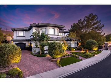 Beautiful front exterior with paved driveway and well-maintained landscaping at 2 Yorkridge Ct, Henderson, NV 89052