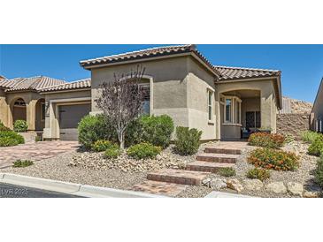 Charming single-story home with landscaped front yard and inviting brick steps to the front door at 3434 Boleo Ct, Las Vegas, NV 89141