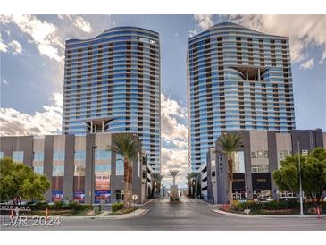 Stunning exterior view of the luxury Veer Towers in City Center Las Vegas with palm trees at 4575 Dean Martin Dr # 2701, Las Vegas, NV 89103