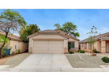 Charming single-story home with a two-car garage and desert landscaping at 7949 Long Beach St, Las Vegas, NV 89139