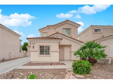 Charming two-story home with stucco exterior, tile roof, and well-maintained landscaping at 8873 Happy Stream Ave, Las Vegas, NV 89143