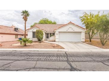 Charming single-story home features a well-maintained yard and attached two car garage at 1220 Basin Brook Dr, North Las Vegas, NV 89032