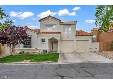 Charming two-story home features a terracotta roof, stucco facade, and a well-manicured front yard at 2124 Rising Mist St, Las Vegas, NV 89134