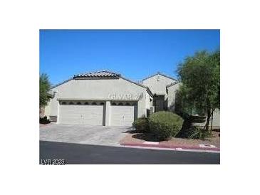 Charming single-story home featuring a two-car garage, desert landscaping, and a neutral color scheme at 8024 Pandur St, Las Vegas, NV 89131