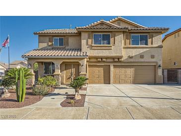 Charming two-story home featuring desert landscaping, a tiled roof, and a spacious three-car garage with an extended driveway at 1191 Starstone Ct, Henderson, NV 89014
