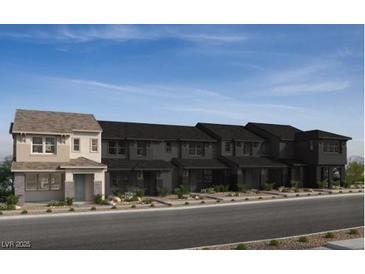 New townhome construction showing multiple units and modern architectural details in a desirable community at 128 Silver Run Ln, Las Vegas, NV 89138