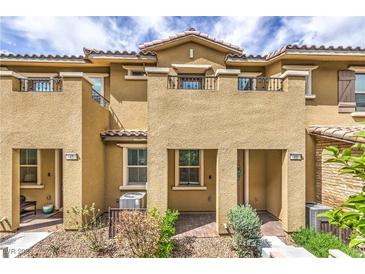 Charming townhome features a covered entryway and low-maintenance landscaping at 49 Alamere Falls Dr, Las Vegas, NV 89138
