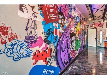 Hallway with custom graffiti art and epoxy flooring at 5626 Deer Creek Falls Ct, Las Vegas, NV 89118