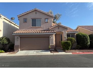 Charming two-story home with a tidy front yard and a two-car garage with a tile roof at 927 Clear Diamond Ave, Las Vegas, NV 89123