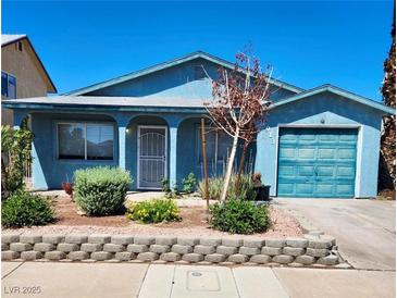 Charming single-story home featuring a well-maintained front yard and attached garage at , Henderson, NV 89011