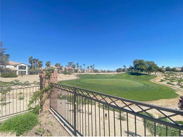 Backyard view of the golf course with lush green grass at 138 Short Grass Ave, Las Vegas, NV 89148
